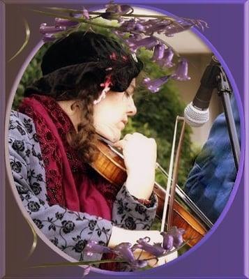 Picture of Terry Ann Playing her violin in Occidental.