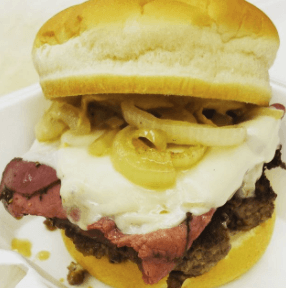 Fat Ca:t pastrami, Swiss caramelized onions, Dijon  on top of a burger