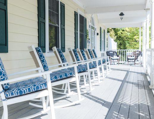 Front porch with rocker chairs.