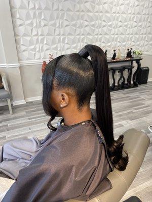 Sleek Ponytail updo on natural hair client.