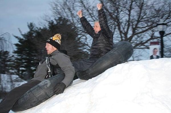 President Andy Card snow tubing with students.