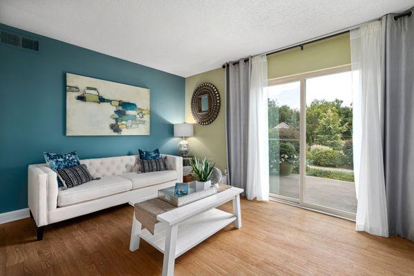 Living room with large patio doors and hardwood floors