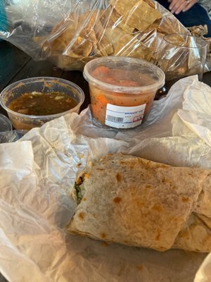 Chili realano burrito, spicy carrots, chips and salsa and more.