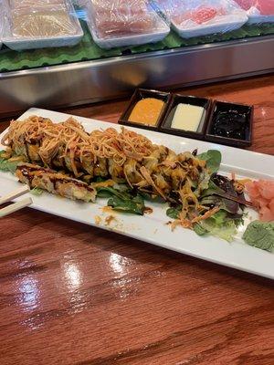 Big Dam Bridge roll with spicy crab added as a topping