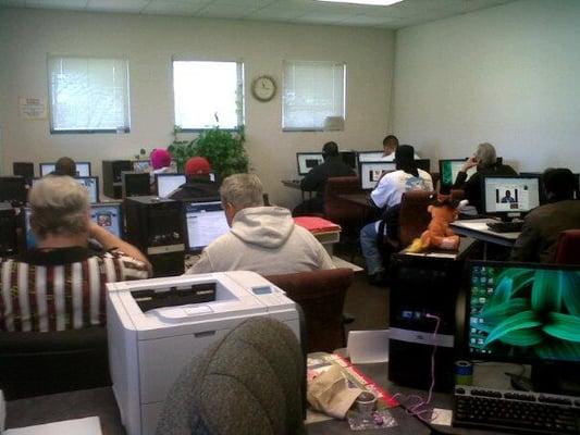 Clients use free computers and Internet access at our DeWitty Center.