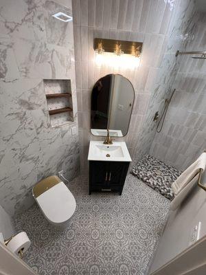 Here is a full bathroom remodel we did from studs to what you see in pic