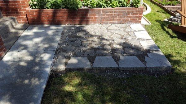 Reclaimed concrete patio pavers.