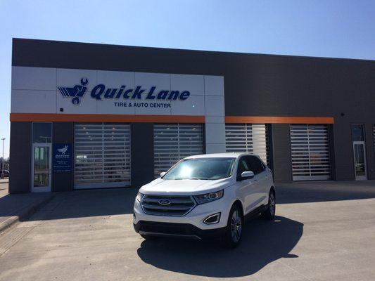 Quick Lane Tire Center with four bays for quick maintenance.