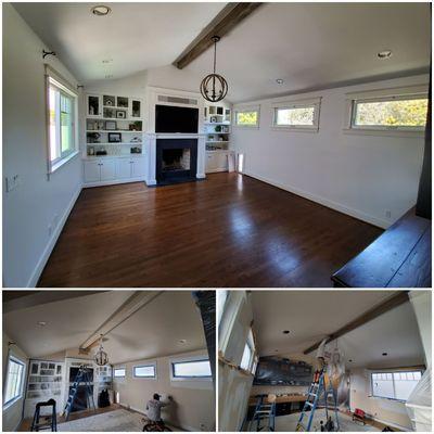 Beautiful living room with faux finished beam in reclaimed wood  look.