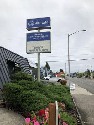 View from the side (Allstate parking lot) and sidewalk sign