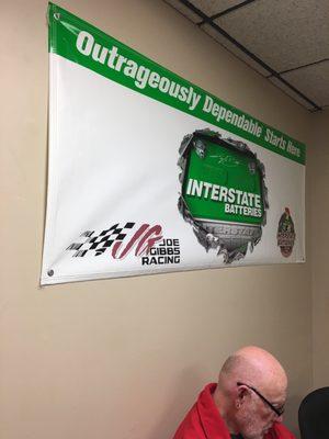 An advertisement sign hanging in the waiting area