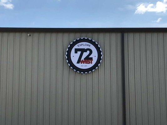 Wall sign for 72 West in Centerton, AR