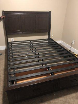 Furniture assembly bed with front drawers.