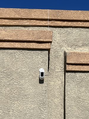 Ring Spotlight Camera with Solar Panel on a flat roof