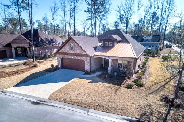 Premier Homes builds single level brick 'retirement smart' homes in Rosewoood Landing, a neighborhood within River Bluffs.