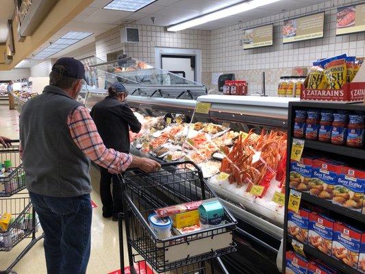 Seafood-fresh and the department clerk helps you pick!