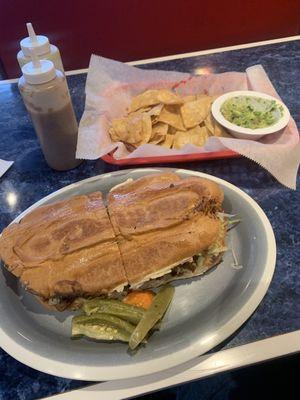 Carnitas torta, chips and guac.