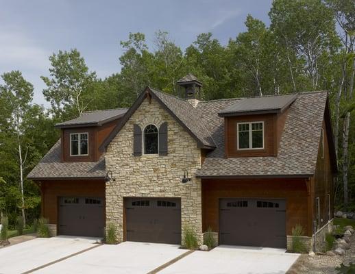 Carriage House with CertainTeed Landmark Presidential Shake shingles, brown metal roof on dormers, Scan Hewn wood siding