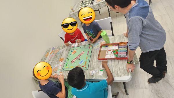 Weekend Camp Group 1; Monopoly! Students learn about money management, investment,  Relative vs. Face(card) value, and so much more!