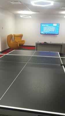 Ping pong and flat screen in lounge area of cafeteria