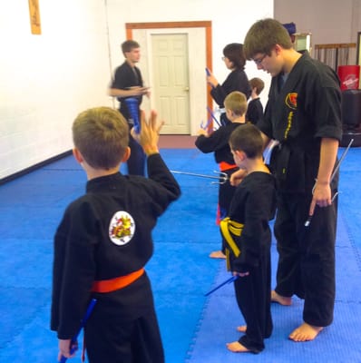 Kobudo (weapons) training instills focus.