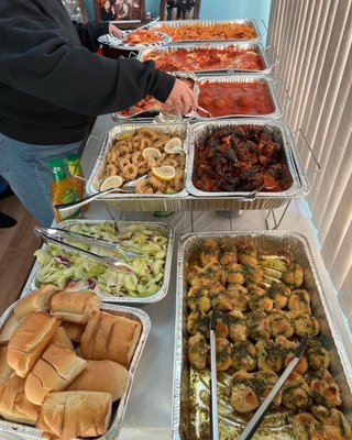 A full tray of penny and vodka, a full tray of chicken Parm, a half a tray of eggplant Parm, a half a tray of Fried Calamari .