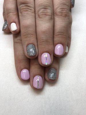 Gel manicure with glitter and striping nail art