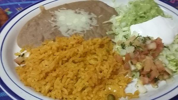 Refried Beans, Rice, and trimmings with Chicken Fajitas.