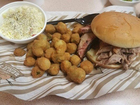 Moist brisket sandwich, fried okra, and potato salad.