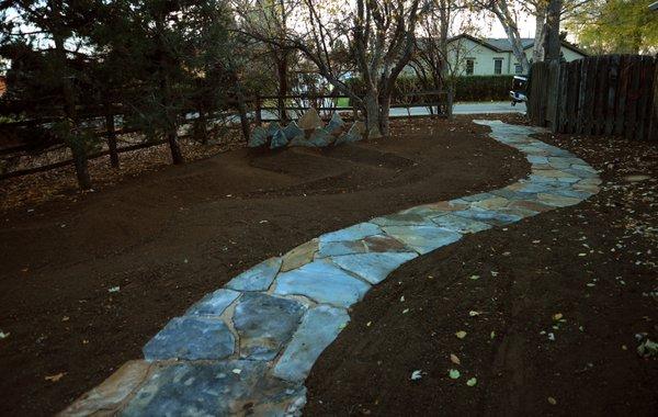 Flagstone walkway and sculpture