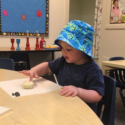 The children make a personal challah (egg bread) every Friday!