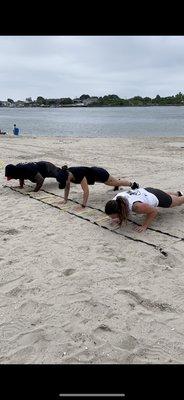 as if pushups aren't hard enough, lets do them in the sand