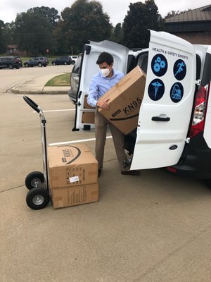 Unloading 5,000 KN Respirator Masks to donate to   Spartanburg District 4