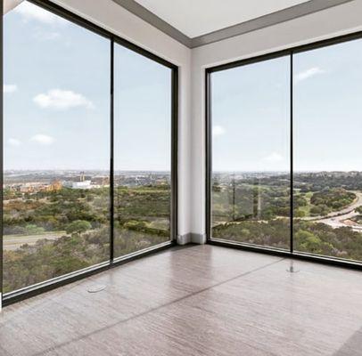 Enjoy floor to ceiling windows at this luxurious La Cantera property