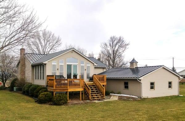 Standing seam metal roof installed by an MR Roofing crew.