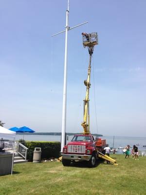 Flagpole repair via boom truck