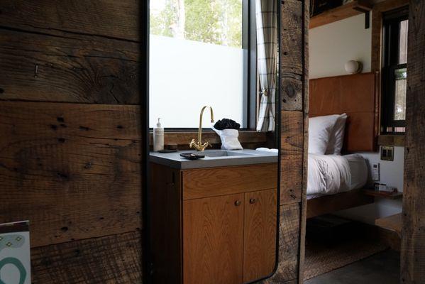 Custom concrete countertops, oak cabinetry, barnwood interior, ensuite bathroom Tofte Trails Mn