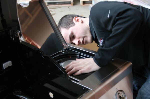 Alec Assembling a Grill at Home Depot