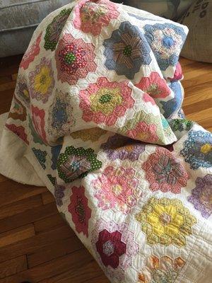 Grandmother's Flower Garden quilt made from reproduction feed sack from Quilter's Corner.