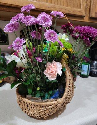 Shopping bags visible with foam showing under flower stalks