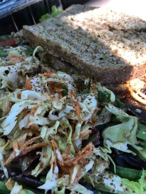 Black bean and avocado sandwich with salad