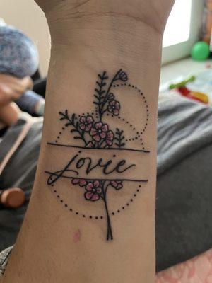 name tattoo with flowers