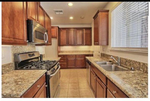 The kitchen! Ample cabinet and storage space! Great lighting!