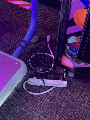 Close up of extension cords into a surge protector. Kids can easily reach this.