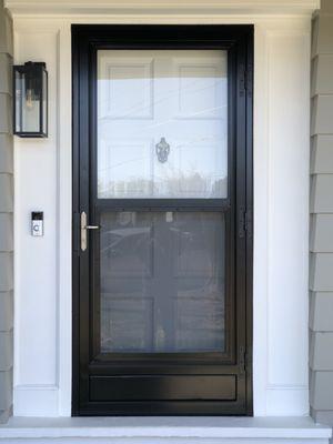 Self Storing Storm Screen Door. Sliding glass with pet proof woven stainless steel screen panel