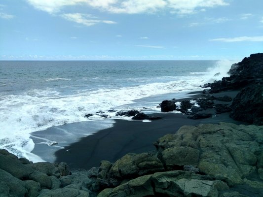 Beautiful black sand beaches here but those waves are rough!