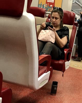 Example of what not to do on Metro North: talk loudly on your phone, use area as personal grooming, feet on seats, etc.