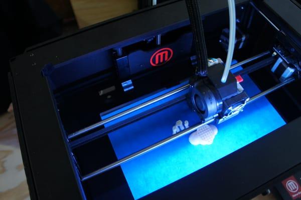 One of our smaller units, the Makergear Replicator 5th Gen at work printing a bust set.