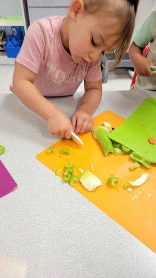 Practicing our cutting and cooking skills in preschool