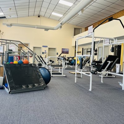 large open room with equipment for stretches & exercises